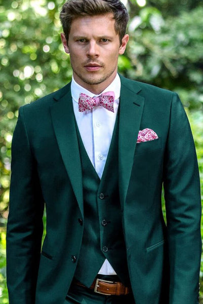 green suit pink shirt