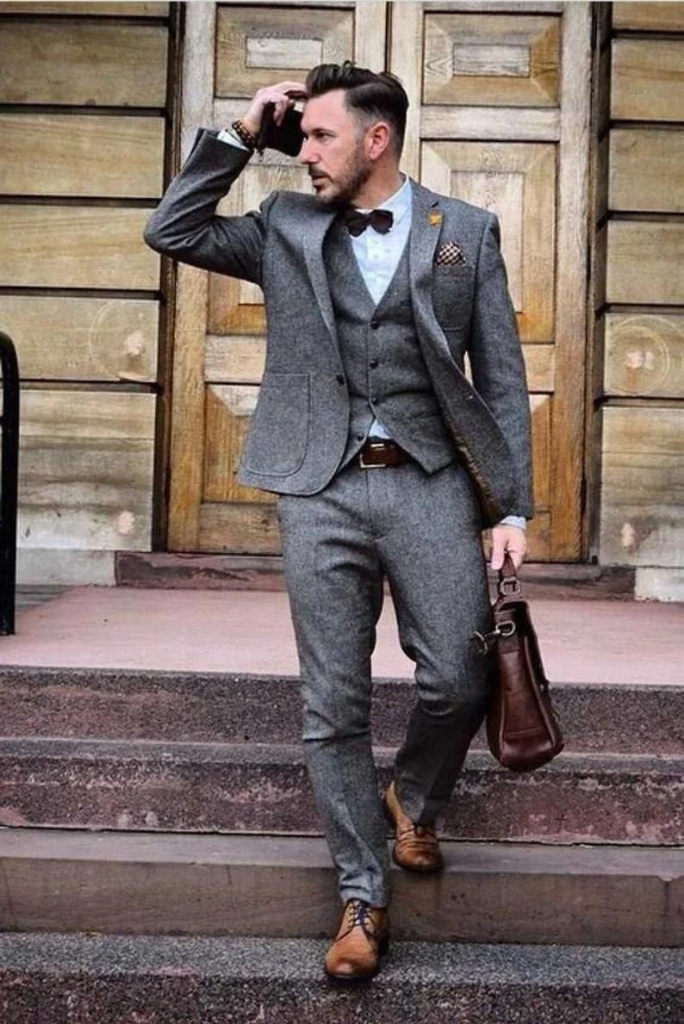 grey suit brown shoes bow tie